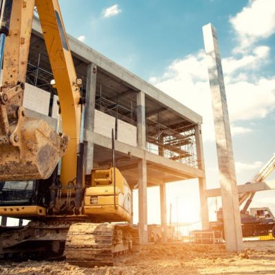 construction equipment in construction new warehouse background